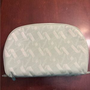 Lrg Neiman Marcus cosmetic bag light green color with a repeating logo pattern